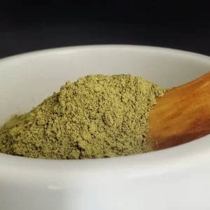 Raw Green Indo kratom powder from batch 15509 displayed in a bowl, showcasing its natural form and vibrant color.