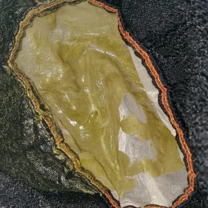 Brewing Kratom Tea Slideshow: Straining Wet Kratom Powder in mesh Strainer and residual leftovers.