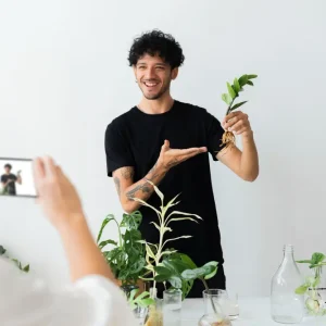 Exploring Kratom Phenotypes: White Maeng Da - A Discussion on Phenotalk. Man Holding Herbs and Discussing Plants.