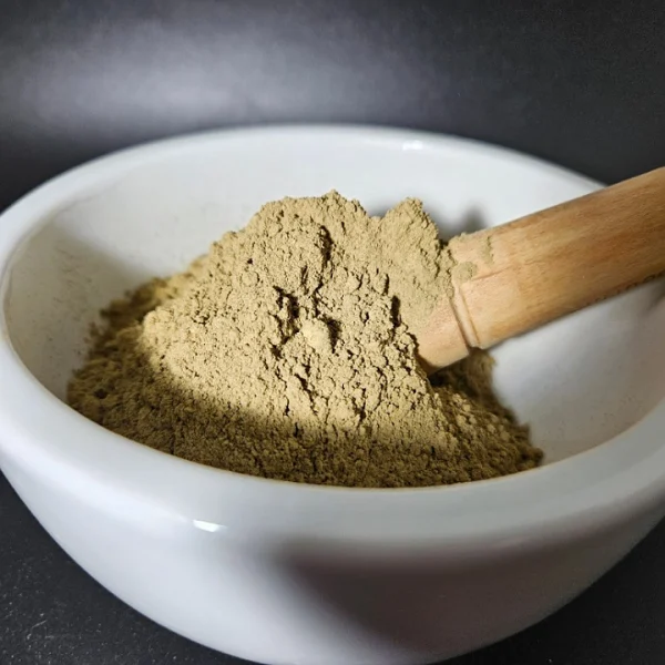 Red Maeng Da Kratom Powder, batch 150223, elegantly displayed in an apothecary bowl.