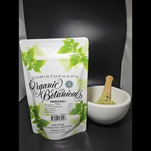Fresh Green Bali Kratom powder from Batch 151514, finely ground and vibrant green in color, displayed in a natural setting.