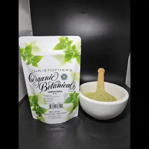 Premium Green Riau Kratom powder from Batch 152312, finely ground with a fresh green color, displayed in a natural setting.